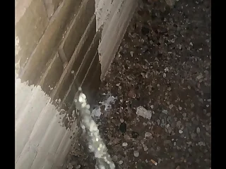 Pissing on a Wall Outside